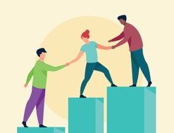 People holding hands on blocks going up